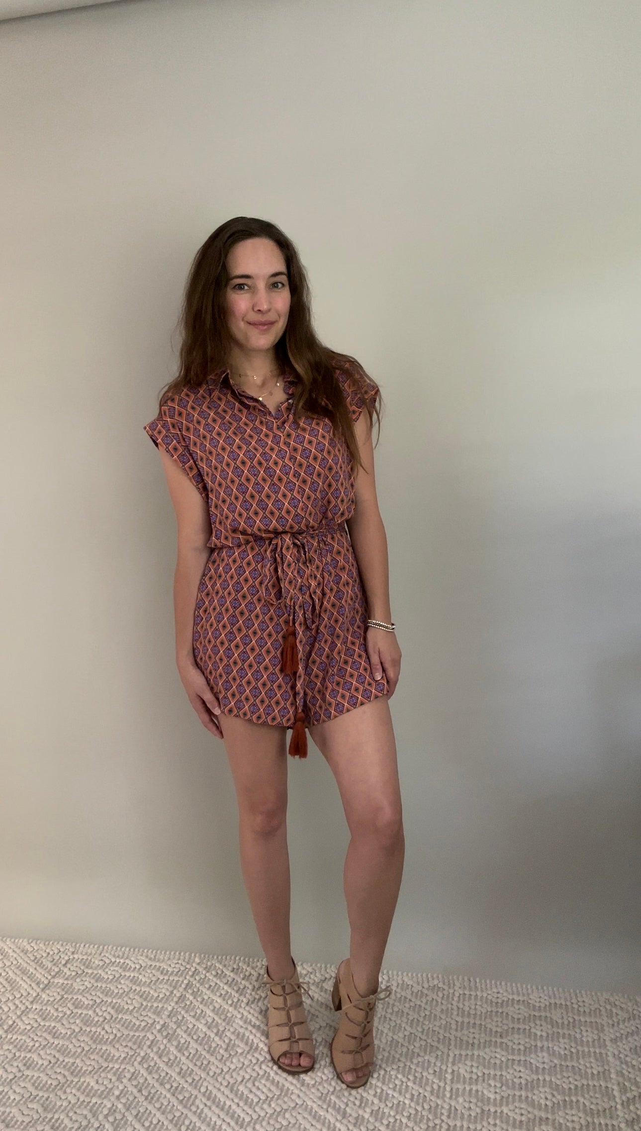Make a statement with this romper! Beautiful print in fall tones with so many details that set this romper apart. Tassel belt, POCKETS, cuff sleeve, hidden chest button closure. Wear it belted or unbelted. This is a must for sure!
